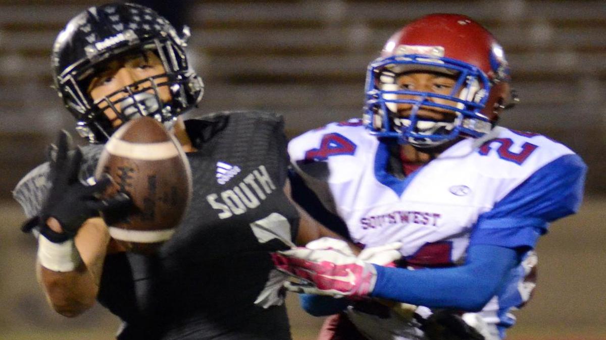 South Hills receiver Tylan Wallace, left, hauling in a one-handed touchdown catch last season against Southwest, had 59 receptions for 1,439 yards and 20 touchdowns a year ago. He has committed to Oklahoma State.