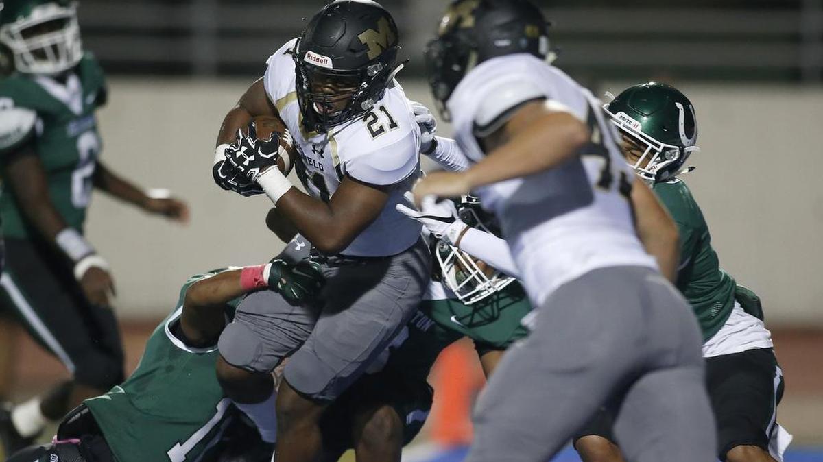 Mansfield Tigers Theo Owens (21)scores a touchdown against the Arlington Colts Maverick Stadium, Oct. 6, 2017.