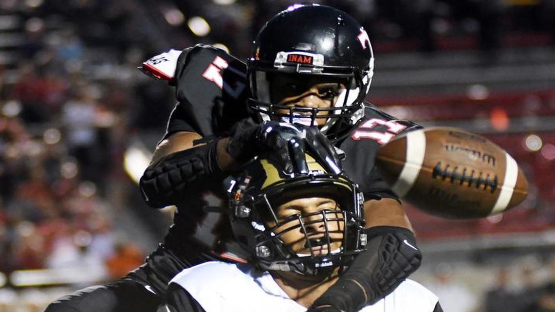 Trinity’s Cameron Jones, 17, back breaks up the pass intended for Broken Arrow receiver Devin Clayton in the endzone during the second quarter of Friday’s, August 26, 2016 football game at Pennington Field in Bedford.