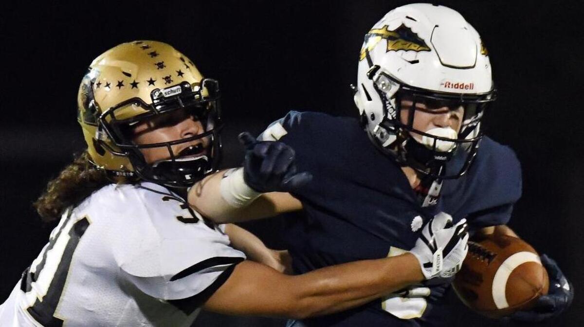 Abilene’s Jorge Hernandez, left, chases Keller running back Michael Anderson in the second quarter, Nov. 2, 2017. Keller won 35-21.