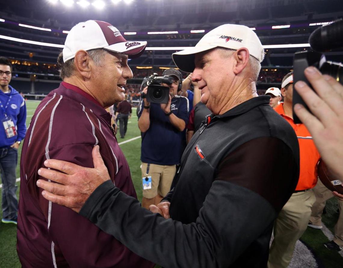 Calallen head coach Phil Danaher congratulates Aledo head coach Steve Wood after the 5A Division II State Championship Game at AT&T Stadium, Friday, December 16, 2016.