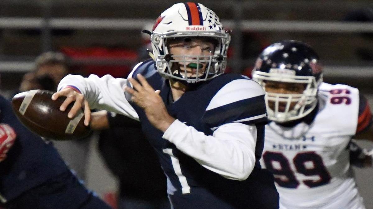 Richland quarterback Trae Self, looks for an open receiver down field against Denton Ryan in the second quarter of Friday's November 18, 2016 high school playoff football game.