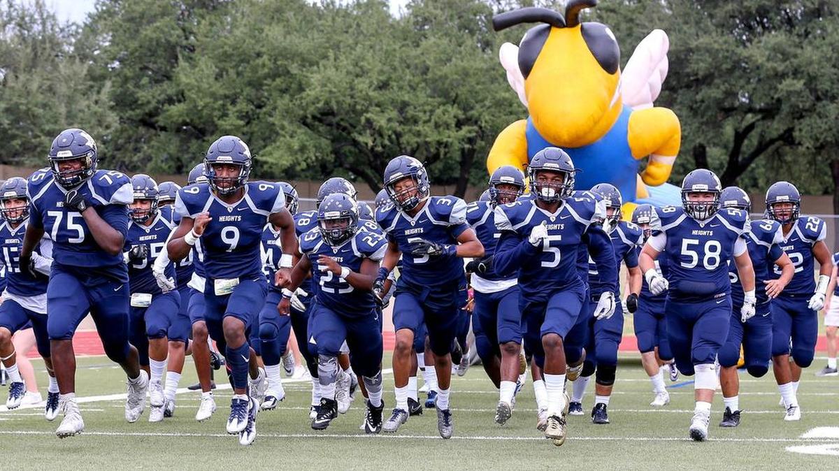 The Arlington Heights Yellow Jackets take the field to face the North Side Steers, Oct. 21, 2017, at Farrington Field.