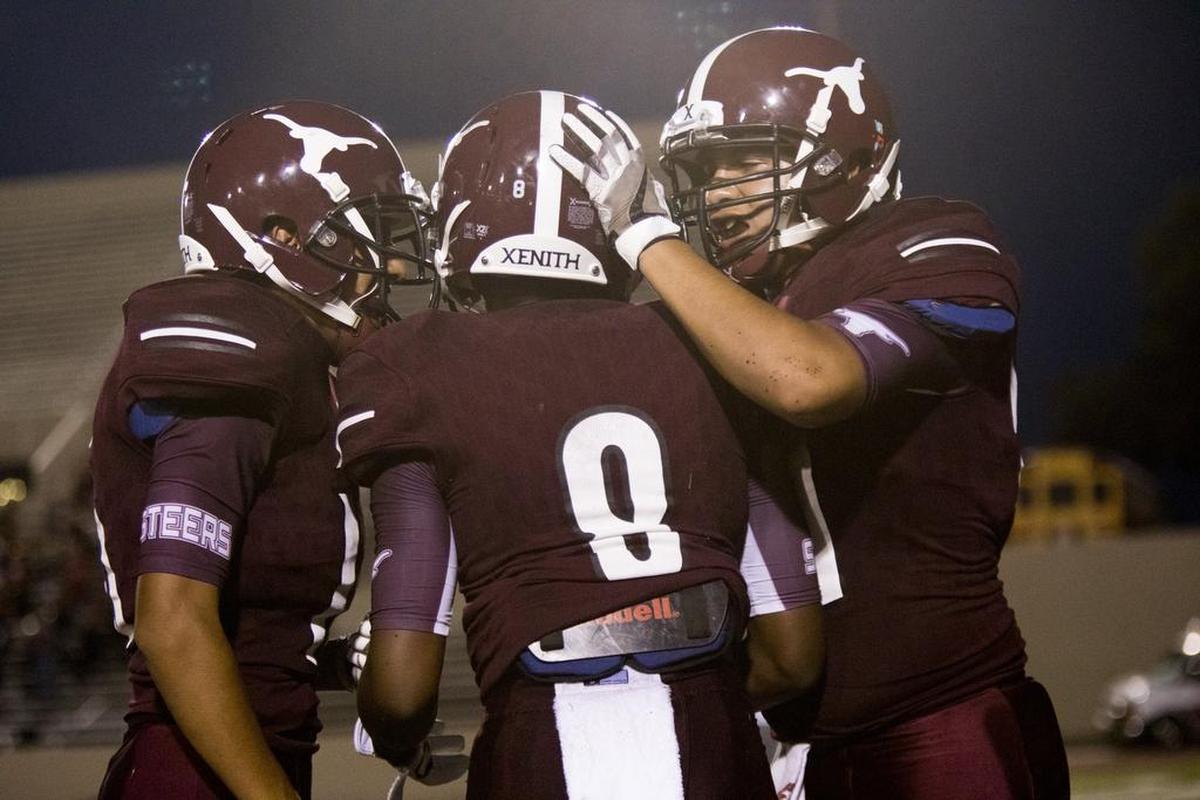 North Side players celebrates a touchdown against Diamond Hill-Jarvis at Farrington Field in Fort Worth, Texas, Sept. 22, 2017.