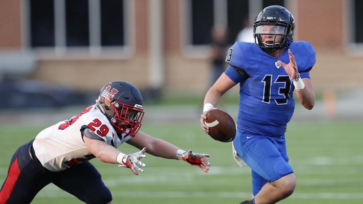 Byron Nelson quarterback Nicholaus Santini (13) rushes the ball past Northwest Hunter Johnson (29) during a high school football game, Friday, September 15, 2017, at Northwest HS Stadium in Justin, Texas.