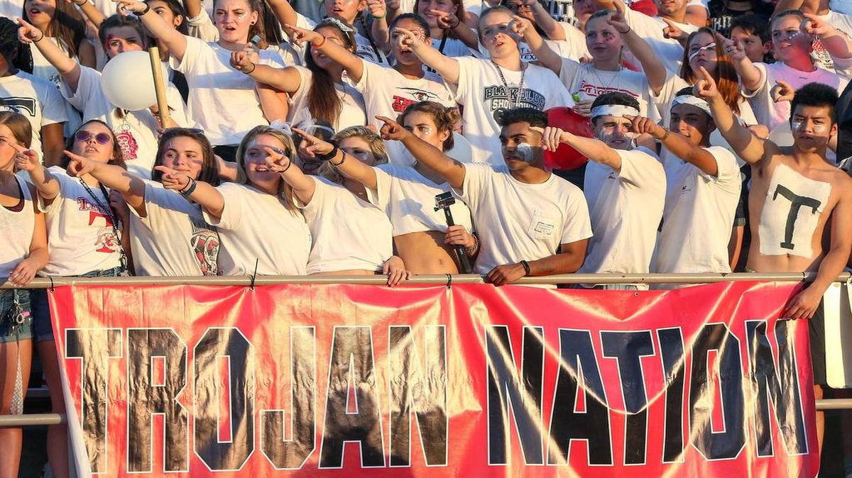 Euless Trinity High School students cheer on their Trojans against Colleyville Heritage, September 9, 2016 at Mustang-Panther Stadium in Grapevine.