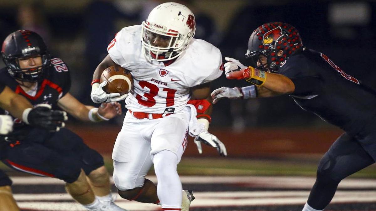 Grapevine Faith running back Keyshawn Wyatt (31) in action against Fort Worth Christian defenders Connor Worsham (20) and Colton Eager (8), Oct. 21, 2016.