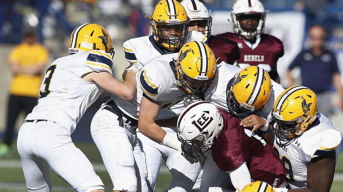 Arlington Lamar defenders deny Midland Lee quarterback Colby Standard.