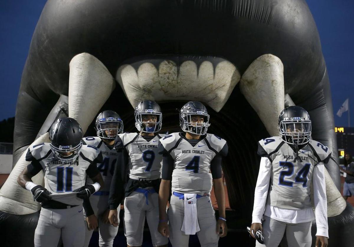 North Crowley Panthers players including quarterback Caleb Leake (4) wait to take the field against the Arlington Colts for the first half of a high school football game at UTA Maverick Stadium in Arlington, Texas on Friday, Sept. 29, 2017.