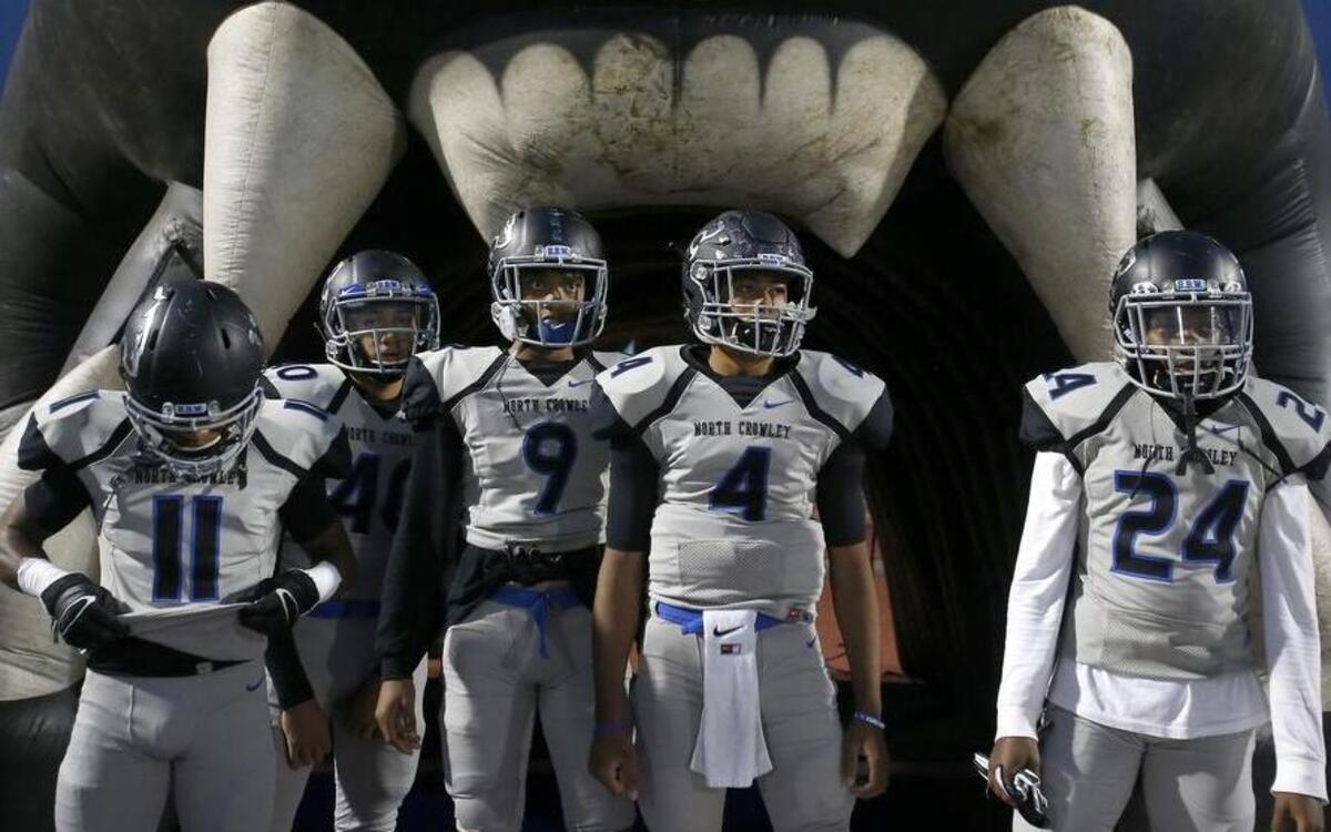 North Crowley Panthers players including quarterback Caleb Leake (4) wait to take the field against the Arlington Colts for the first half of a high school football game at UTA Maverick Stadium in Arlington, Texas on Friday, Sept. 29, 2017.