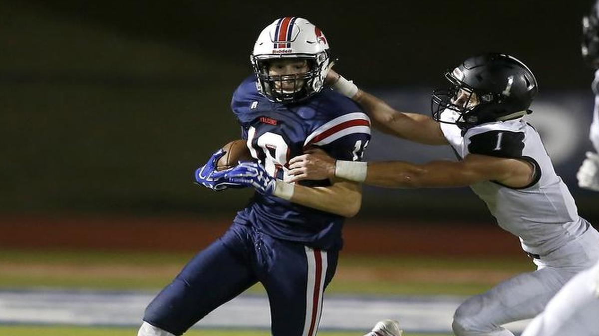 Country Day Falcons safety Turner Symonds (18) returns an interception against the Cistercian Hawks in the second half of the 3A SPC Championship game at McNair Stadium in Fort Worth, Texas, Nov. 4, 2016. Country Day won 52-17.