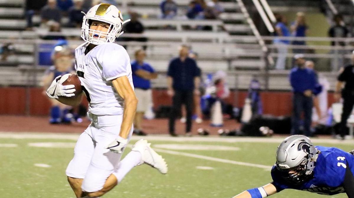 Austin Robinson (5) of Cleburne out runs Charlie Lambert (23) of Burleson Centennial, Sept. 30, 2016.