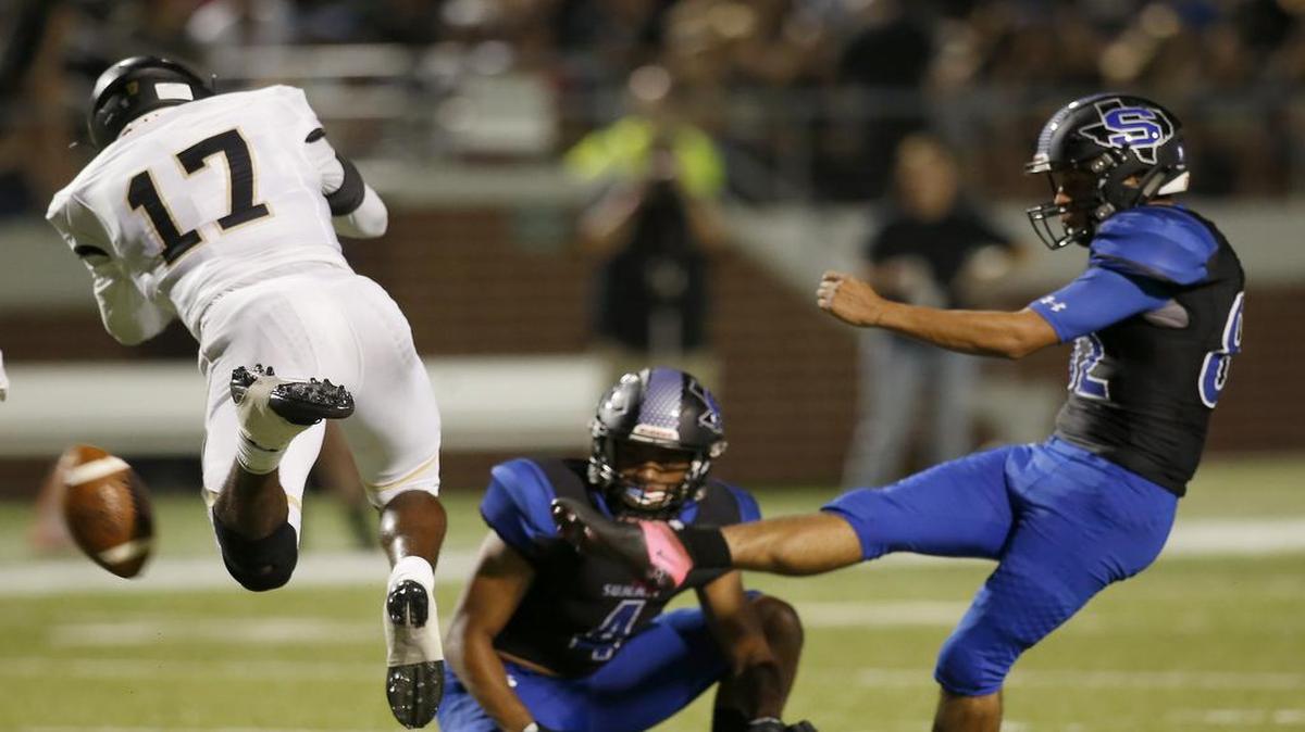Mansfield Tigers safety Cam'Ron Jones (17) blocks a field goal attempt from Mansfield Summit Jaguars kicker Jonas Huffaker (82) during the second half of a high school football game at Newsom Stadium in Mansfield, Texas on Friday, Sept. 1, 2017. The Tigers returned the block for a touchdown.