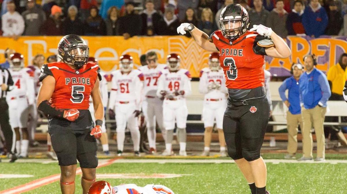 Thomas Chapman, right, and teammate Nick Clark celebrate a tackle against Grapevine earlier this season.