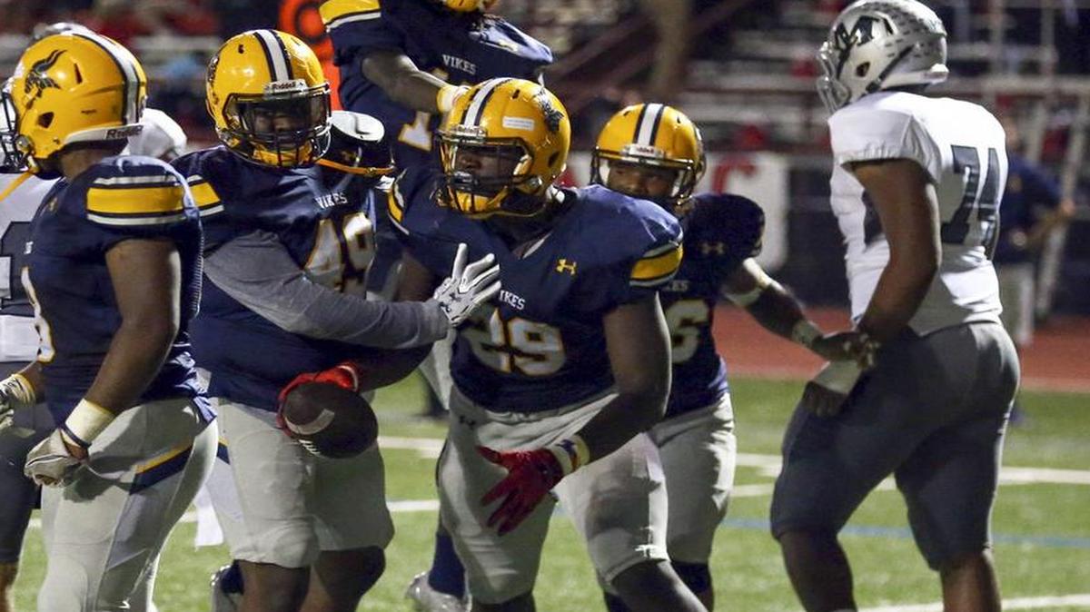 Lamar Vikings celebrate a touchdown from a fumble recovered in the end zone by Bobby Brown (29) against Martin in a high school football game at Cravens Field in Arlington, TX Thursday, November 3, 2016.