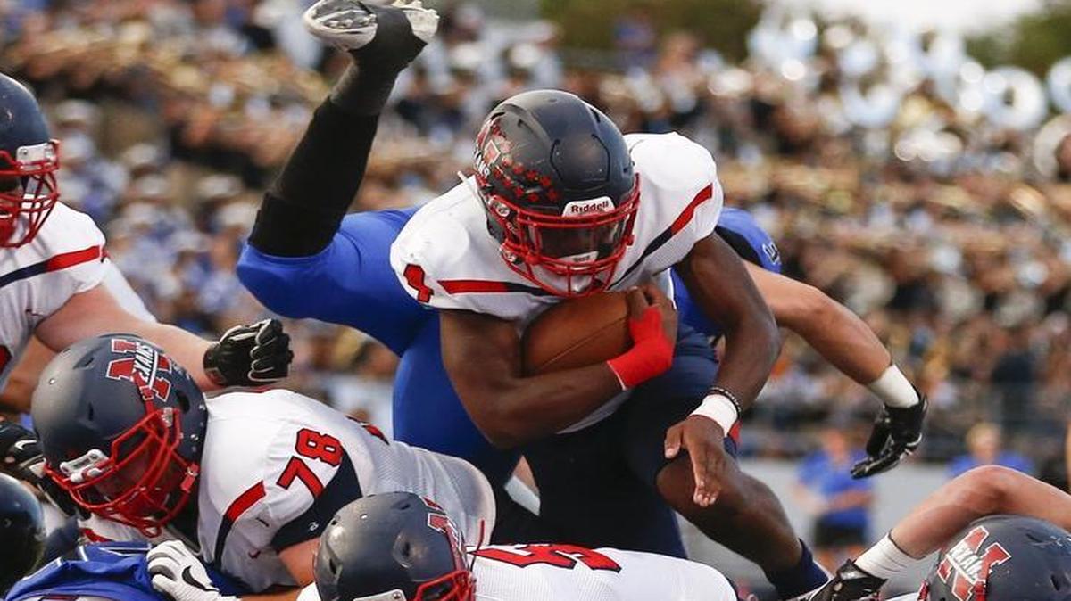 Justin Northwest running back Demareus Hosey drives across the goal line for a touchdown against Trophy Club Nelson during a Sept. 2017 game at Northwest ISD Stadium. The Northwest ISD is now requiring fans attending football games and other varsity events at the stadium to enter with clear, small bags.