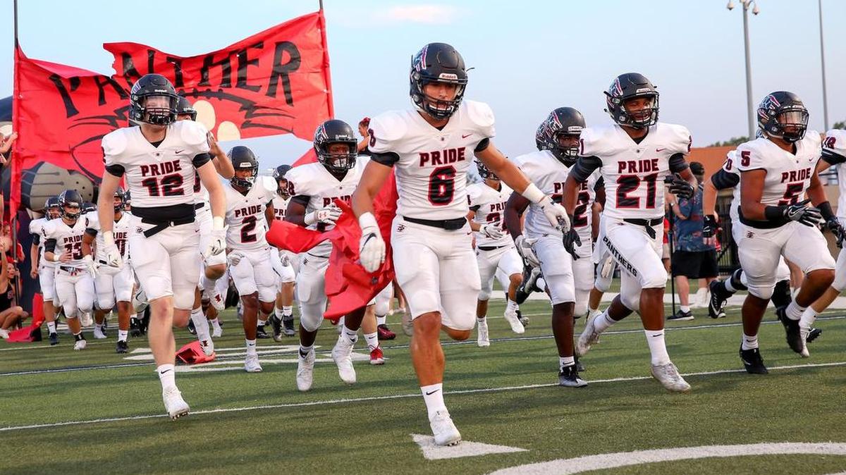 Colleyville Heritage enters the field to play the Trinity Trojans at Pennington Field, Sept. 15, 2017.