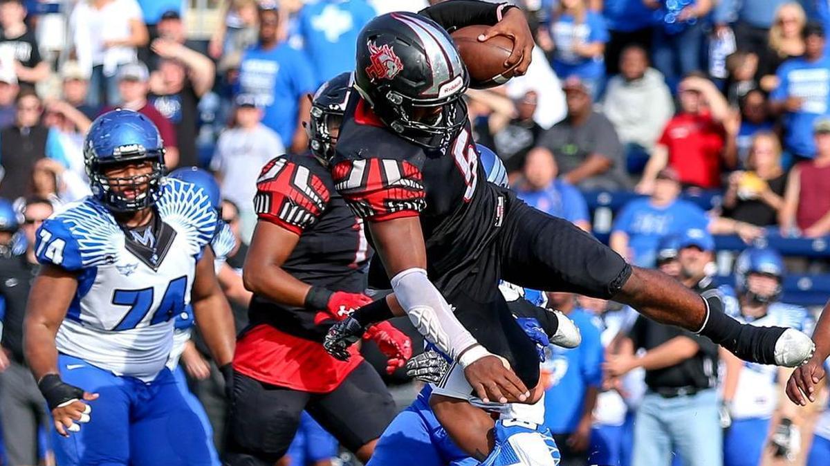 Mansfield Legacy quarterback Jalen Catalon (5) attempts to evade North Forney defensive back KC Cornelious (19).