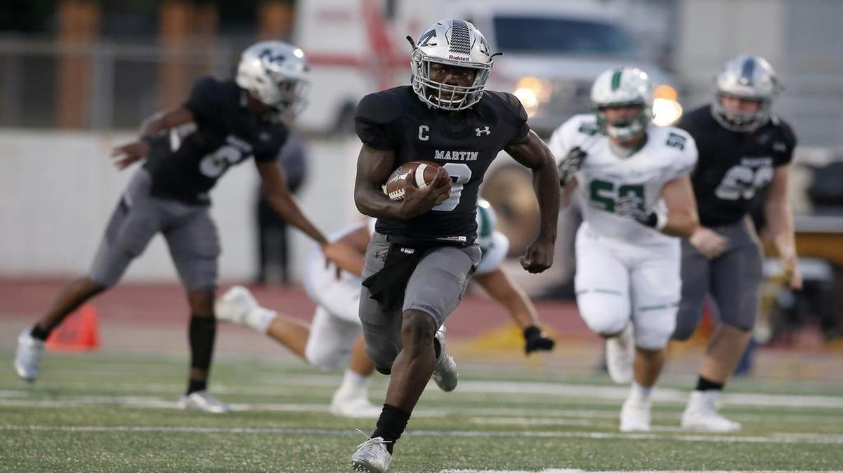 Arlington Martin Warriors quarterback back Juma Otoviano (8) breaks free for a long run against the Southlake Carroll Dragons during the first half of a high school football game at UTA Maverick Stadium in Arlington, Texas on Friday, Sept. 8, 2017.