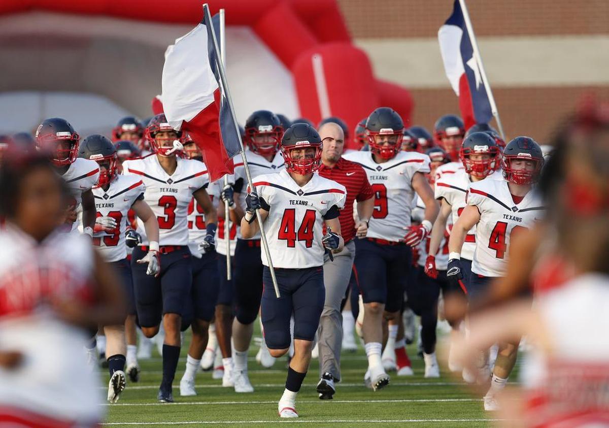 Justin Northwest linebacker Cooper McDonald (44) leads his teammates onto the field at Northwest HS Stadium in Justin, Texas.