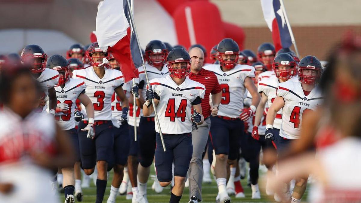 Justin Northwest linebacker Cooper McDonald (44) leads his teammates onto the field at Northwest HS Stadium in Justin, Texas.