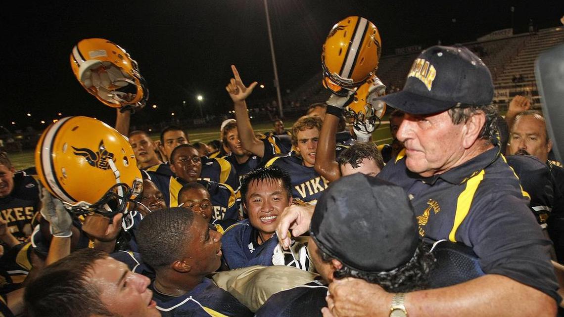 Lamar head coach Eddy Peach is lifted into the air by his players after his 300th win in the Arlington Lamar vs. Keller Fossil Ridge game at Cravens Field in Arlington on August 29, 2008. Peach became the winningest Class 5A coach and the 6th all time 300 game winner.
