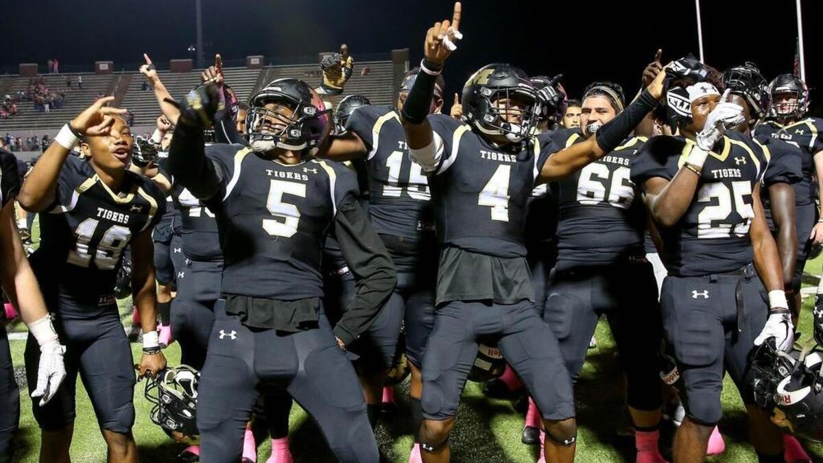 From Week 7 against Arlington Martin, the Mansfield Tigers celebrate a 27-16 win - Oct. 13, 2017.