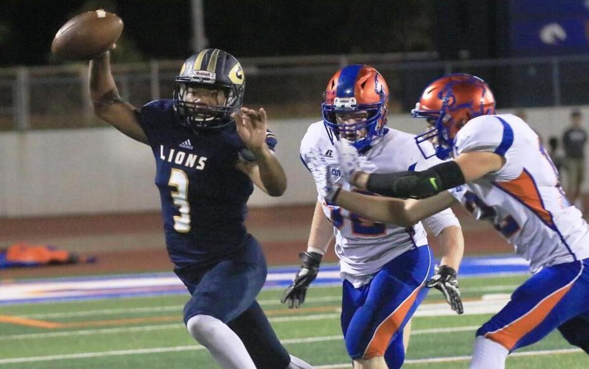 Jeremiah Tucker (3) of Grace Prep avoids Colleyville Covenant players Josh Reed (52) and Jackson Wagoner (12) in a game at Maverick Stadium in Arlington, Oct. 27, 2016.