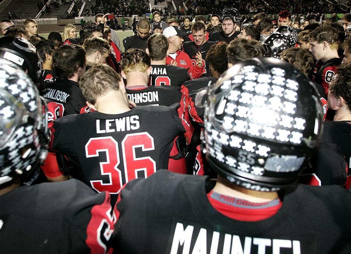 Burleson coach Gary McElroy, surrounded by his team after a playoff loss last season, believes keeping his team informed after Jonathan Lopez’s accident was imperative.