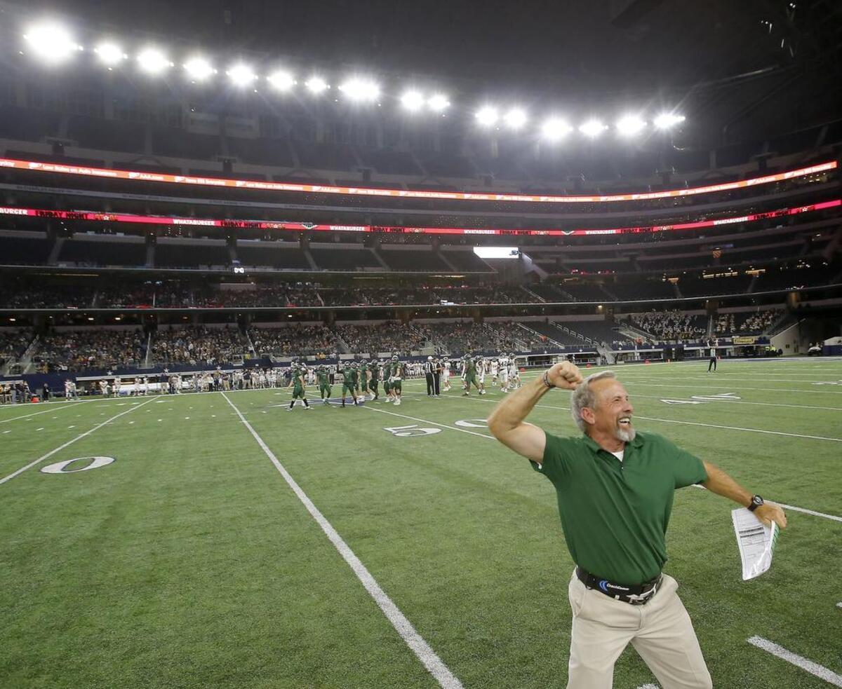 Kennedale Wildcats head coach Richard Barrett celebrates Friday’s 54-28 win against the Stephenville Yellow Jackets.