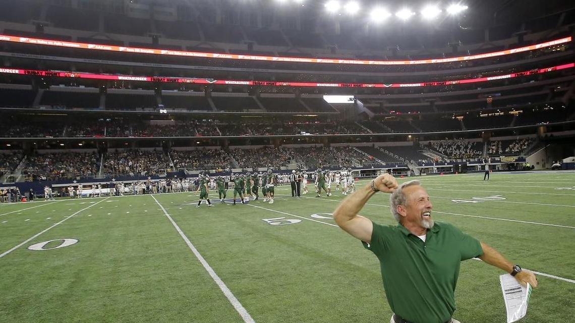 Kennedale Wildcats head coach Richard Barrett celebrates Friday’s 54-28 win against the Stephenville Yellow Jackets.