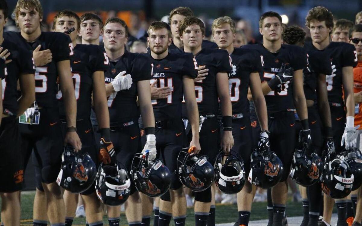 The Aledo Bearcats stand during the playing of the national anthem before Friday’s home game against Westlake Village, Calif.
