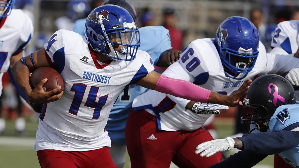 In Week 9 action, Southwest quarterback Octavio Martinez (14) scrambles for yards against Wyatt.