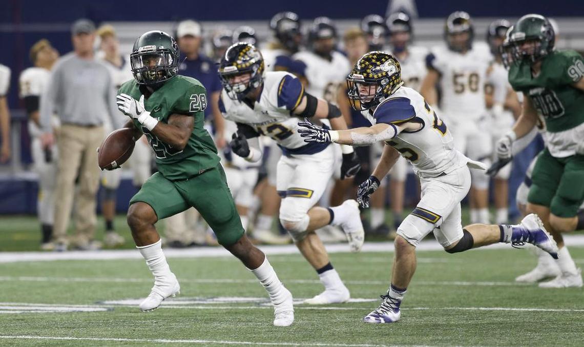 Kennedale running back D.J. Kirven (28) breaks a long run for one of his five rushing touchdowns in Friday’s Class 4A playoff semifinal win over Stephenville.