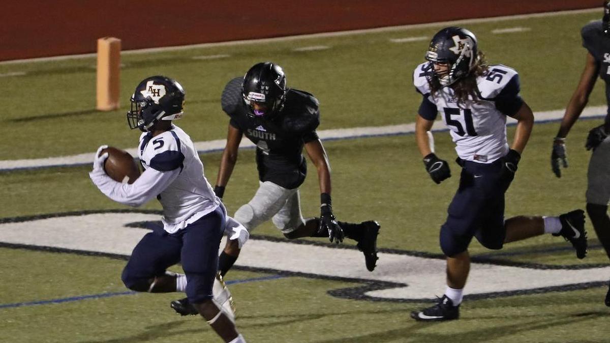 South Hills running back Anthony Watkins (5) has a clear path into the end zone for a touchdown to give the Scorpions the lead in the third quarter against Arlington Heights.