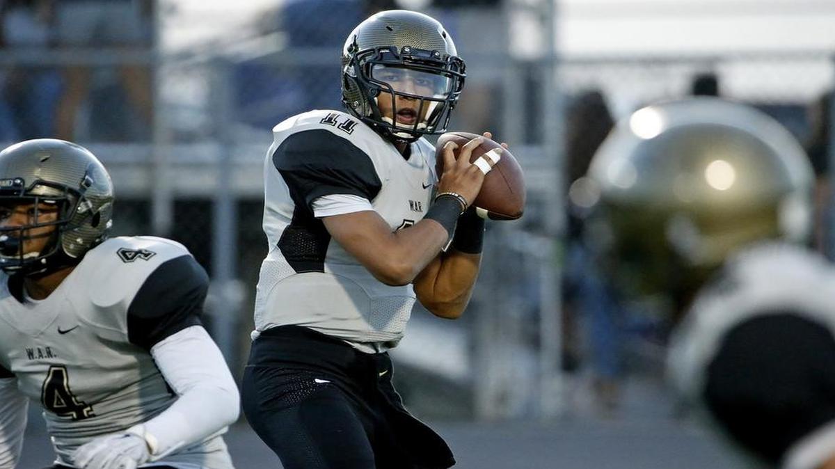 Cleburne QB Tre'Von Bradley (11) looks for a receiver in the first quarter vs. North Crowley Friday, September 9, 2016.