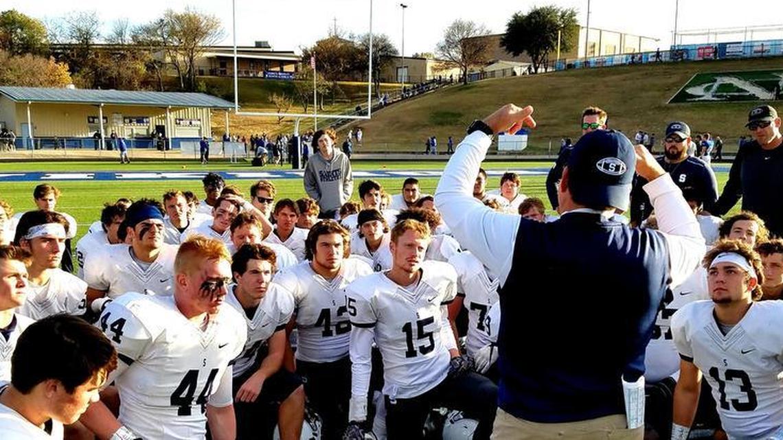 All Saints coach Aaron Beck addresses the team following a 47-14 victory over Nolan Catholic in the TAPPS Division I playoffs.