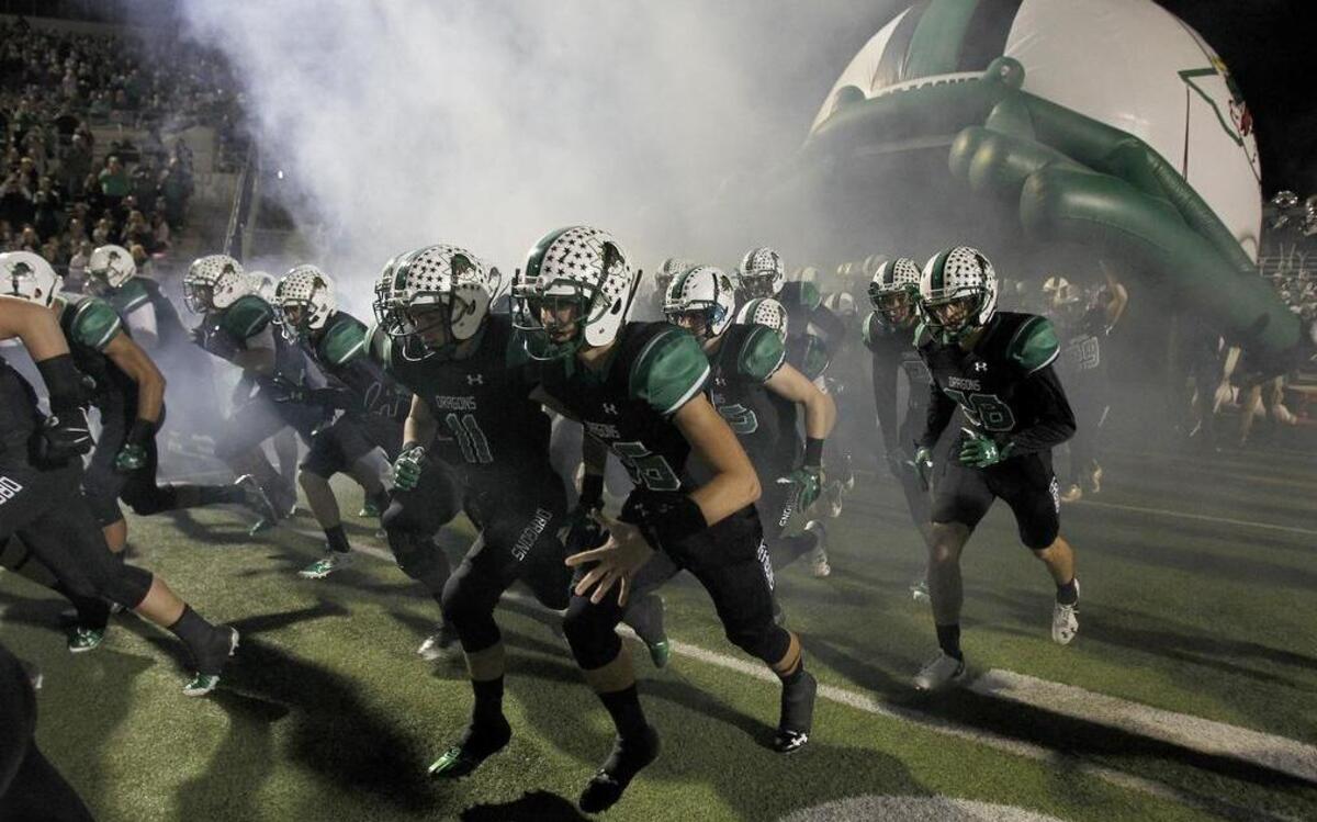 Southlake Carroll makes an entrance against Cedar Hill in a Class 6A bi-district playoff football at Dragon Stadium in Southlake on Friday, November 13, 2015.