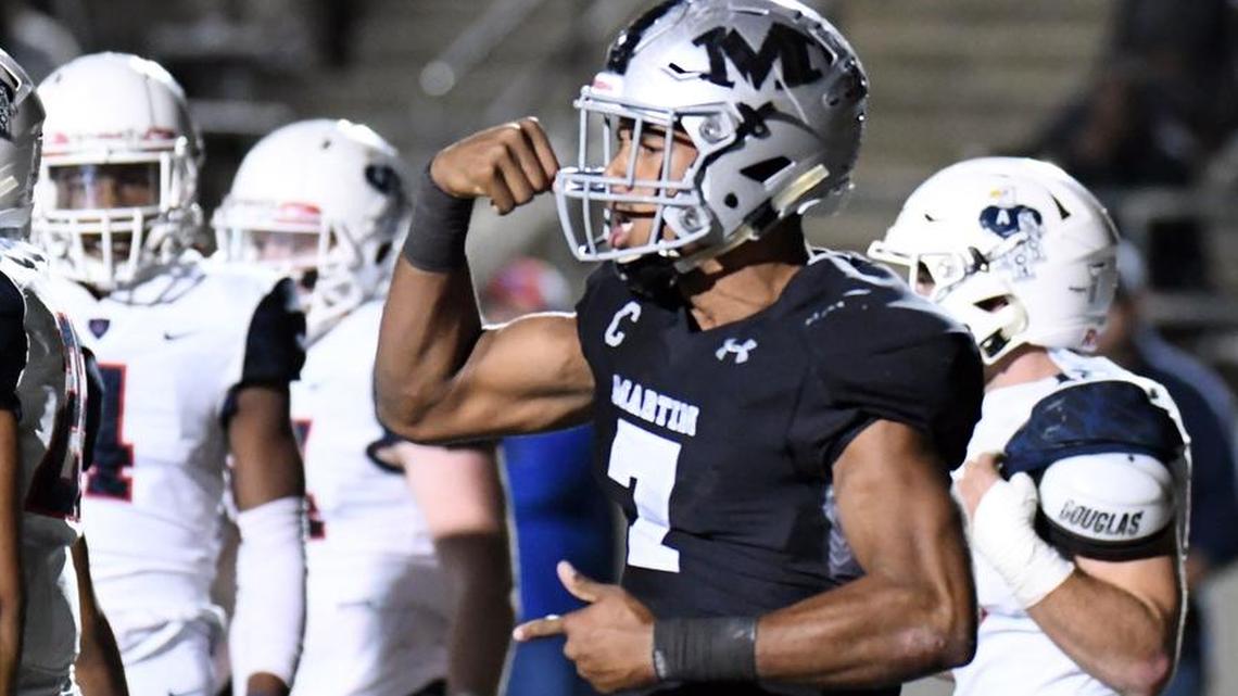 Arlington Martin's Brayden Willis (7) celebrates a touchdown against Allen, Dec. 1, 2017.