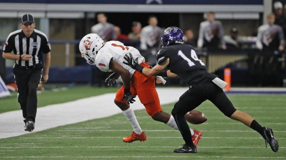 Aledo's Jay Miller (1) can't hang on to a second quarter third down pass, shoved out of bounds by CS Harrison Wellmann (14) as the College Station Cougars beat the the Aledo Bearcats 20-19, Saturday, December 23, 2017. The two teams met for the Class 5A Division II state championship at AT&T Stadium in Arlington, Texas.