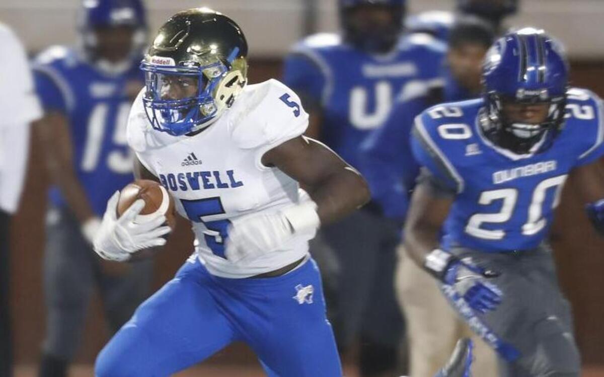 Boswell running back Damon Williams (5) breaks tackles for yardage against Fort Worth Dunbar. Williams broke the school single-season rushing record last week after rushing for 187 yards against Fort Worth Dunbar. Williams has 1,755 yards rushing in nine games.