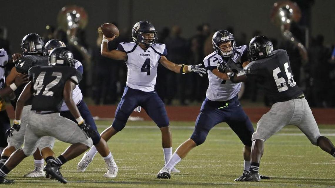 Arlington Heights quarterback Deontre Jones (4) looks for a receiver against the South Hills defense, Oct. 13, 2017.