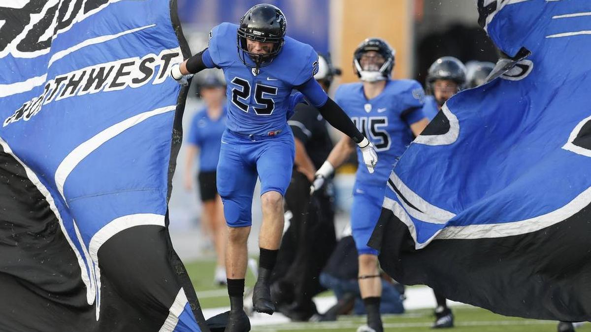 Trophy Club Byron Nelson senior defensive back Keaton Shedden leads his teammates onto the field during an early-season game.