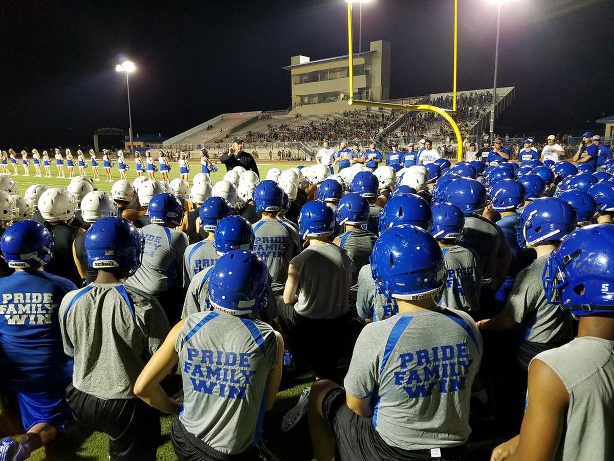 Boswell coach John Abendschan preps his players before the Pioneers take the field at midnight, Monday August 14, 2017 at Boswell High School.