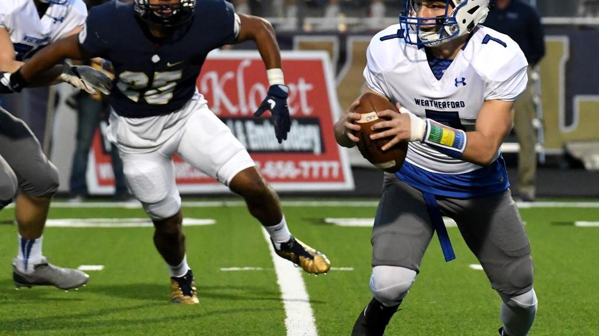 Weatherford quarterback Corban Campbell, (7) scrambles outside the pocket looking for a receiver downfield.