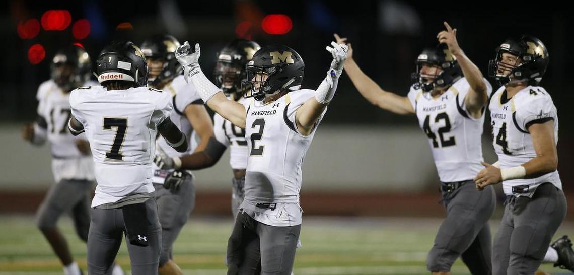 The Mansfield Tigers defenders Kason McCullough-Cooper (7), Corbin Frederick (2), Jarrett Skaggs (42) and Robert Shaw (44) react to a fourth-down stop against the Arlington Colts, Oct. 6, 2017.