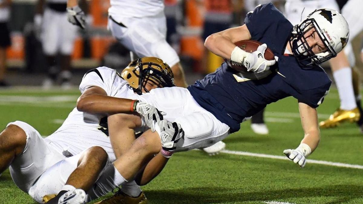 Abilene’s Phillip Tellez, left, brings down Keller’s Matt DeWitt on a kickoff return in the second quarter, Nov. 2, 2017.