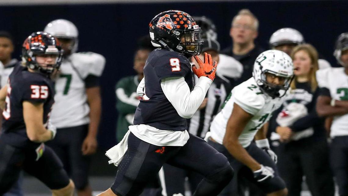 Aledo running back Jase McClellan (9) runs against Mequite Poteet during the first half of the 5A Division II State Semi-Finals, Friday night, December 9, 2016, played at the Ford Center in Frisco.