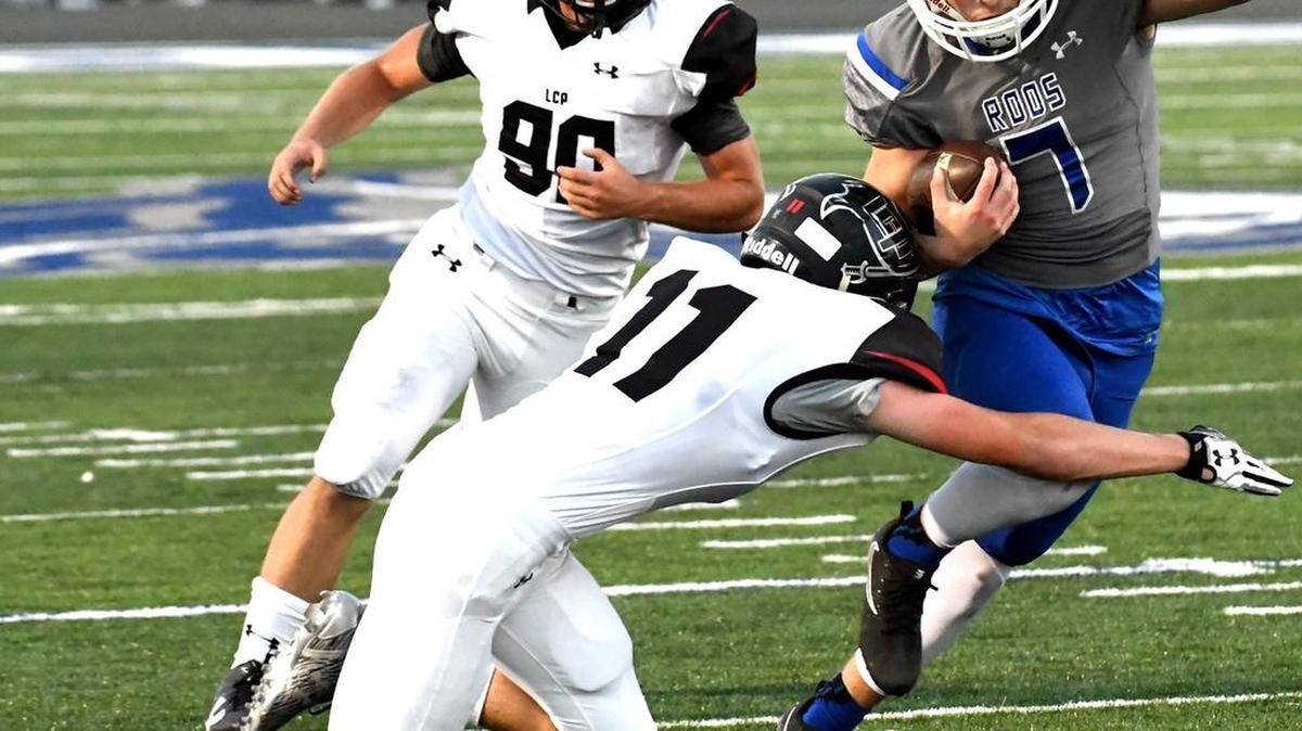 Weatherford’s Corban Campbell (7) attempts to evade Lubbock Cooper defender Payton Bourquin (11).