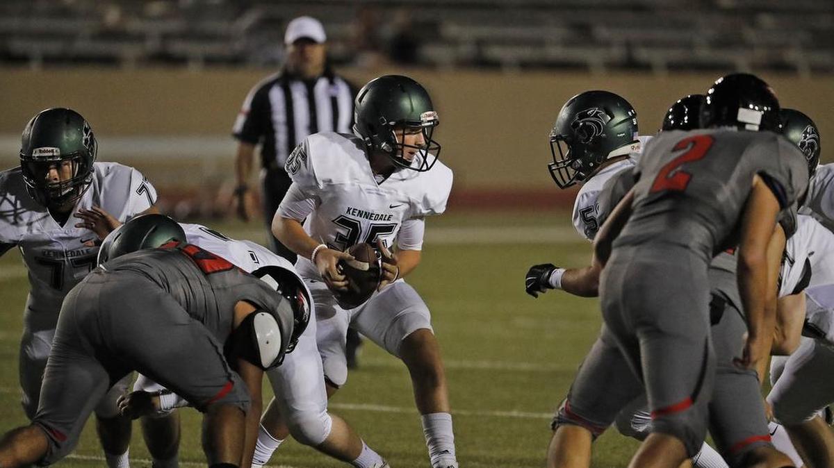 Kennedale quarterback Seth Paroulek (35) and the Wildcats blew out Carrollton Ranchview.